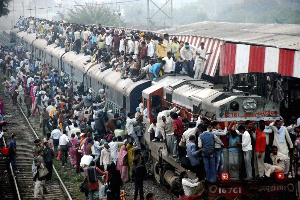 Hindu devotees travel in an overcrowded train as they return after taking holy dips in the Ganges river near Chandause, Uttar Pradesh state, India, Monday, Oct. 29, 2012. (AP Photo) INDIA OUT